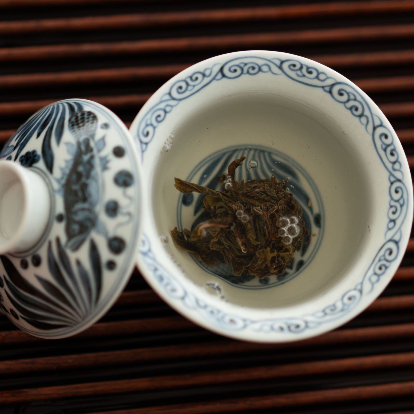 Top view of Nanpo tea leaves steeping in gaiwan
