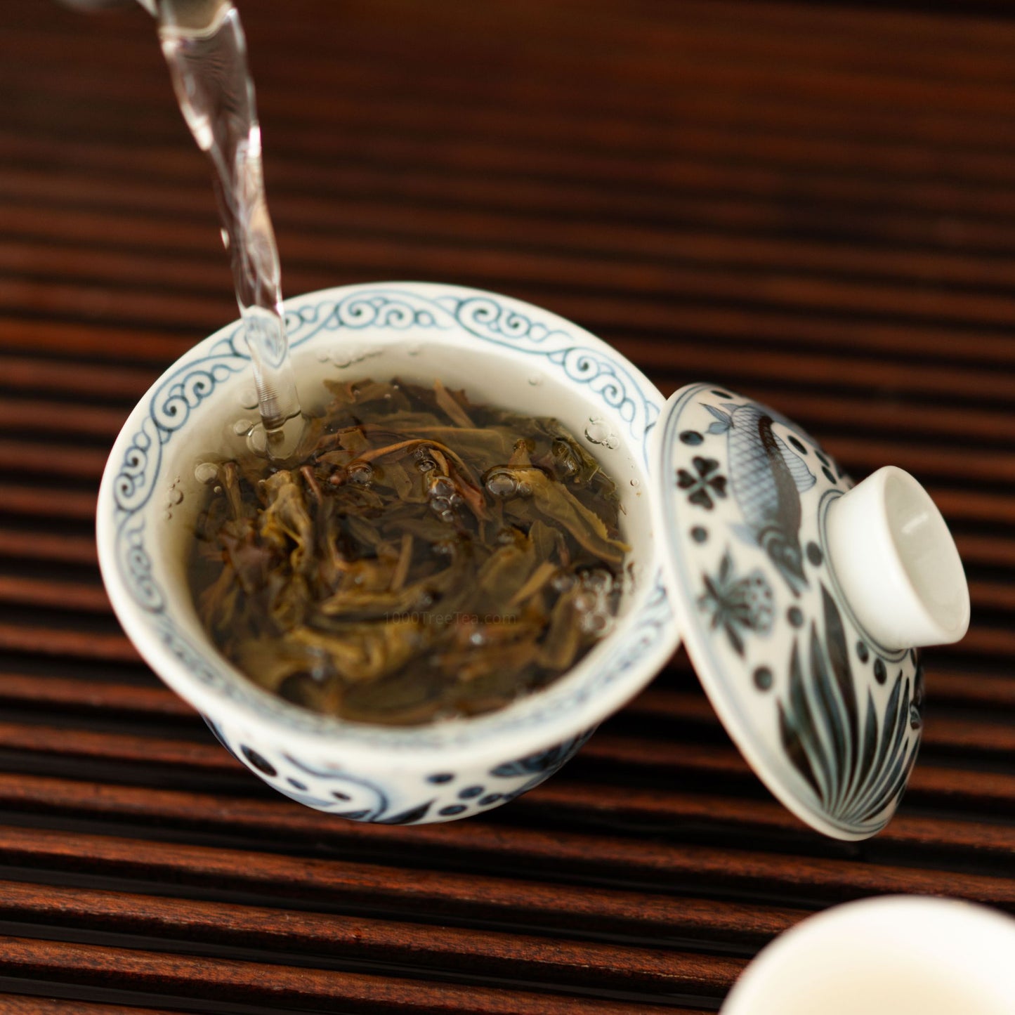 Pouring water over opened Nanpo tea leaves